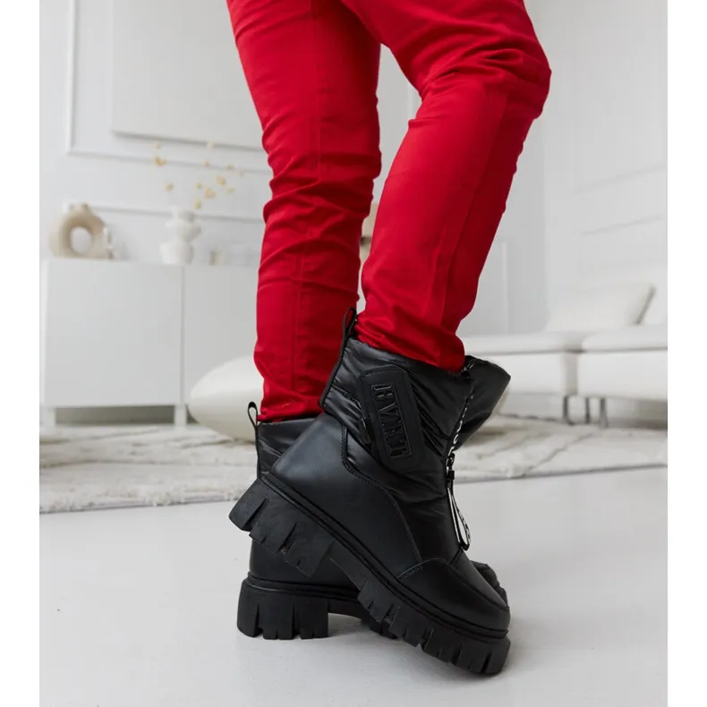 Black insulated snow boots with Eulalia inscriptions