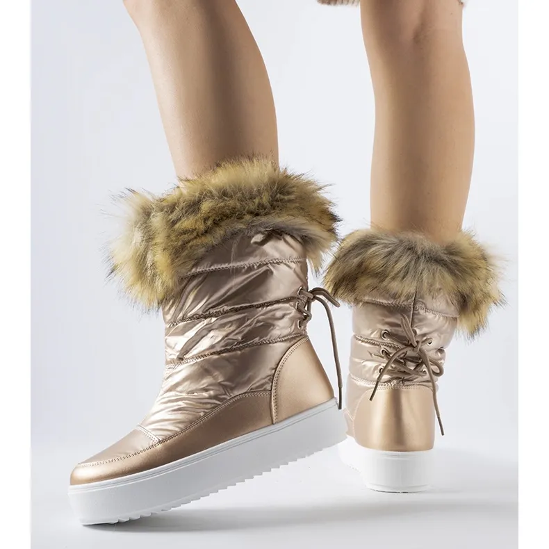 Igne metallic snow boots with decorative fur golden